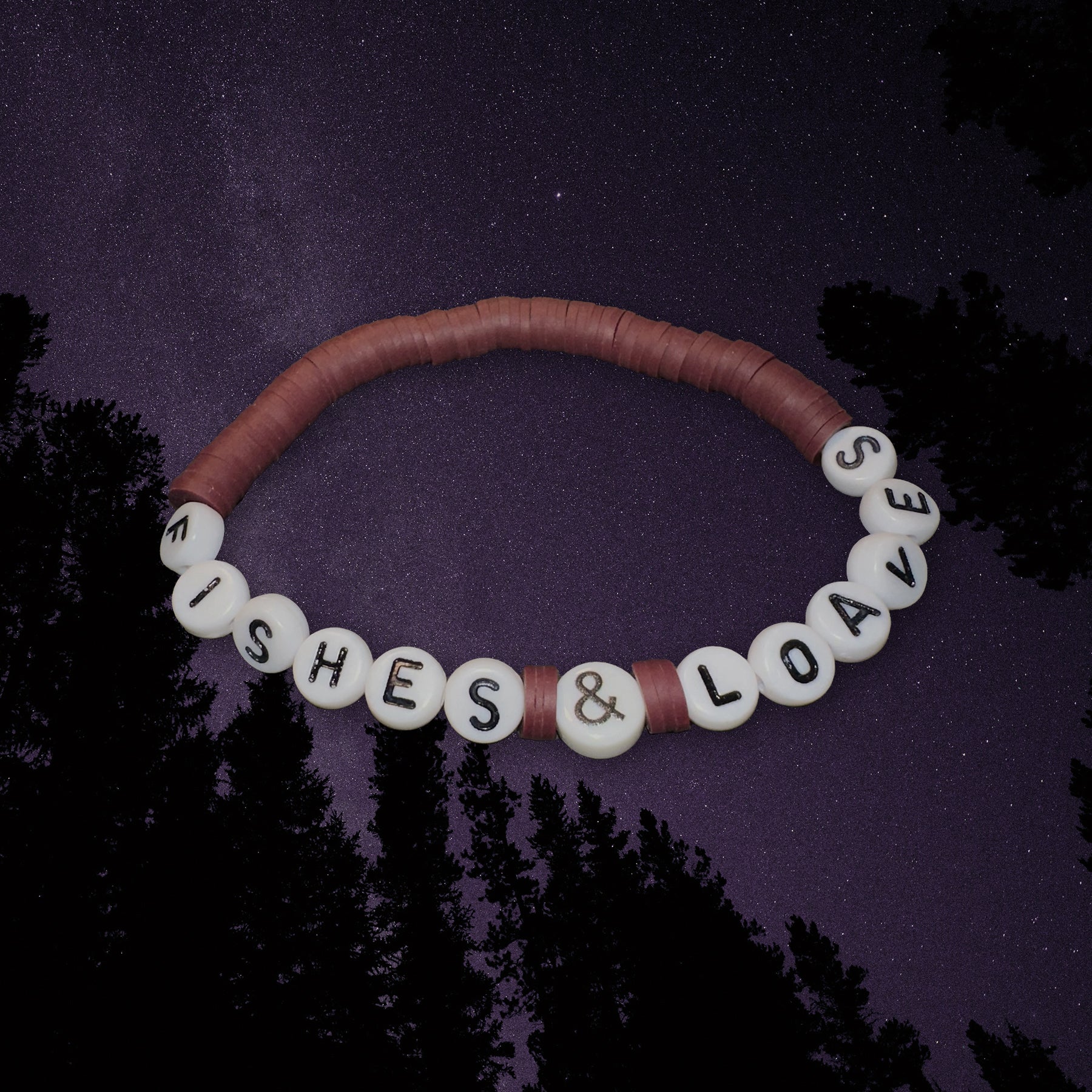 Bracelet with 'Fishes & Loaves' on a dark background