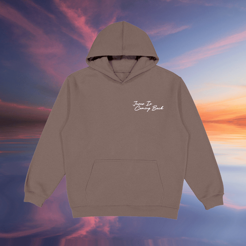 Brown hoodie with text on a colorful sky background