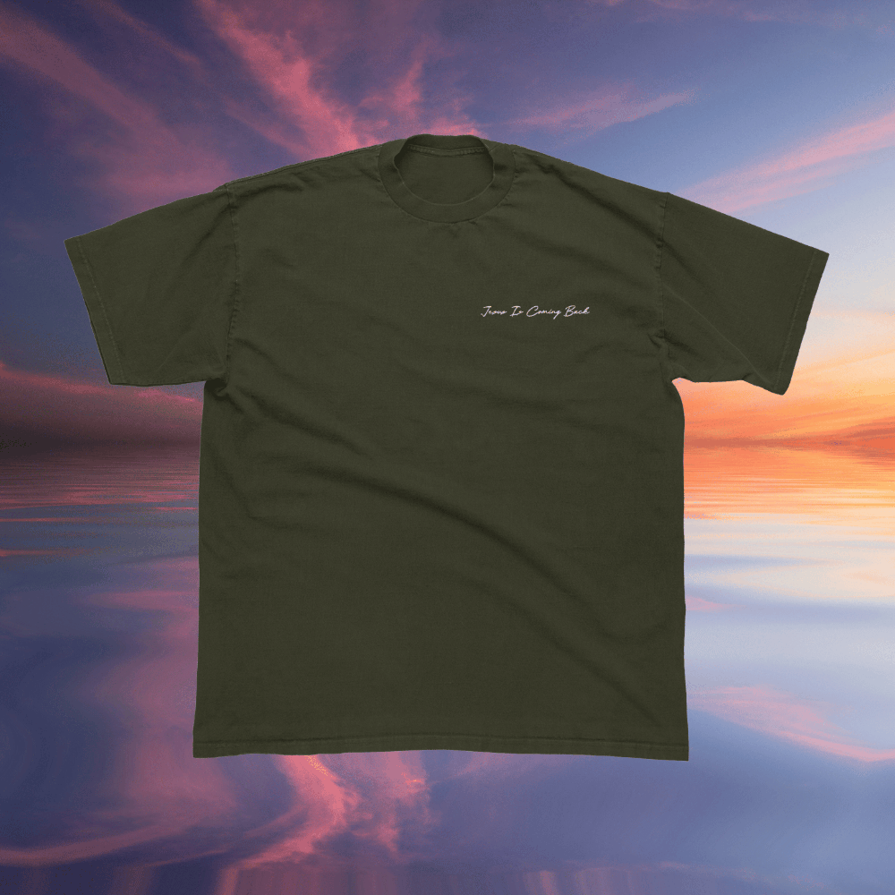 Green t-shirt with text on a colorful sky background